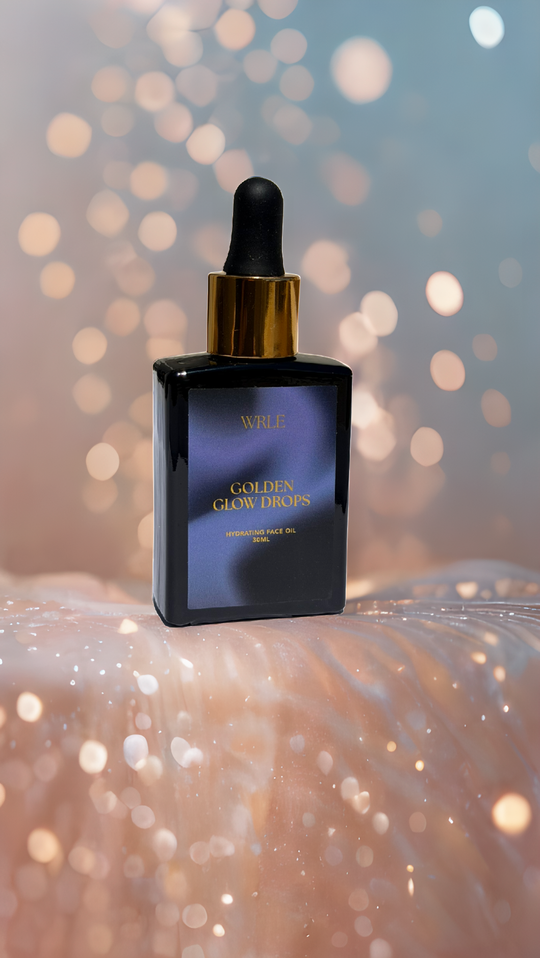 Vial of wrle oil with dropper against a blurred golden background