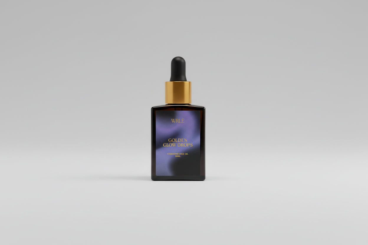 Vial of WLE Colleen Glaze Drops on a white surface with wooden background